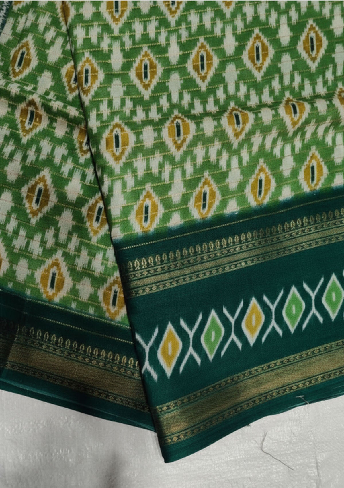 Premium Green Ikat Saree with Gold & White Diamond Motifs