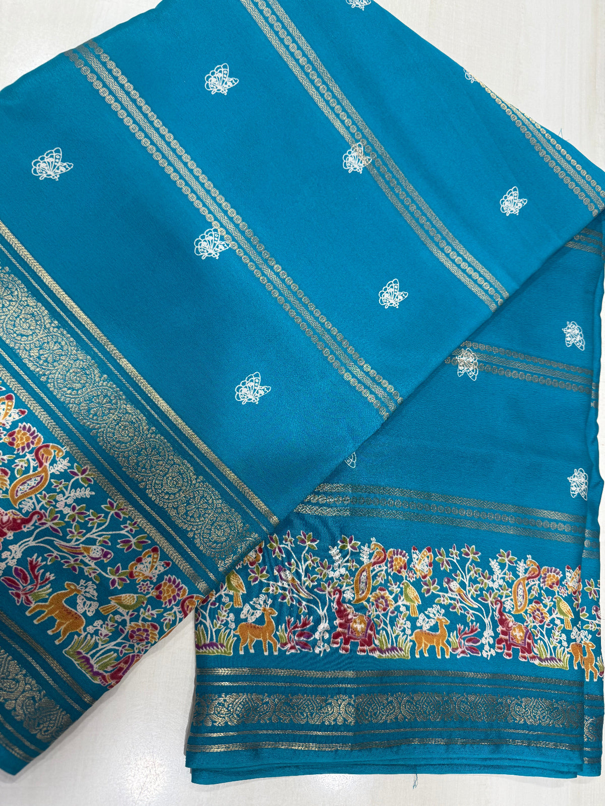 Exquisite Nature-Inspired Soft Silk Saree with Wildlife Border & Butterfly Buttas