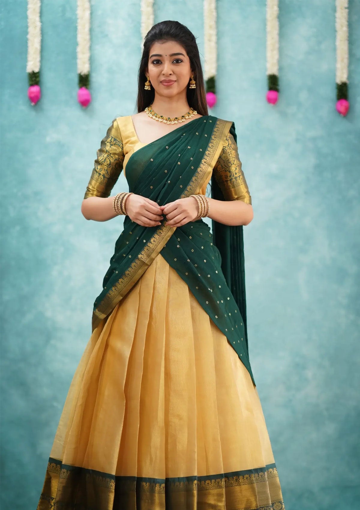 Izhaiyini Dark Bottle Green Shade and Gold tone Organza Halfsaree